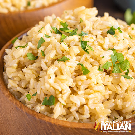 bowl of instant pot brown rice garnished with parsley