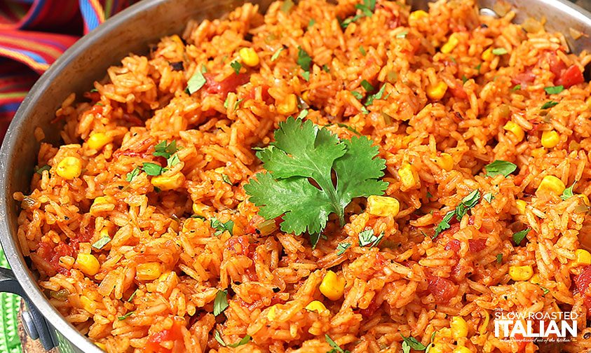 grains of fluffy basmati with corn and spices in skillet