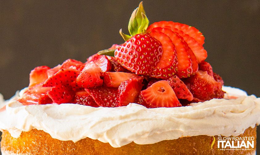 fresh red berries on layer cake