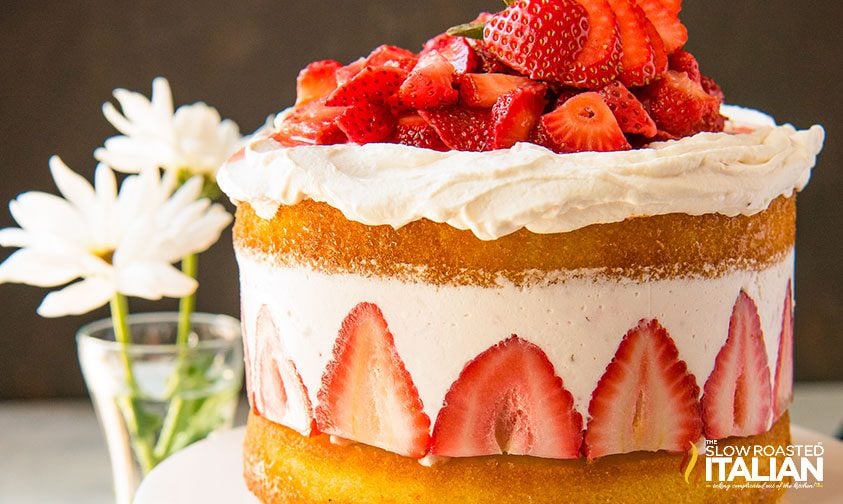strawberry shortcake cake decorated with fresh berries