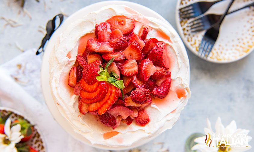 overhead: fresh strawberry slices on frosted shortcake