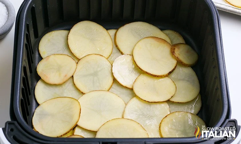 homemade potato chips in basket of air fryer