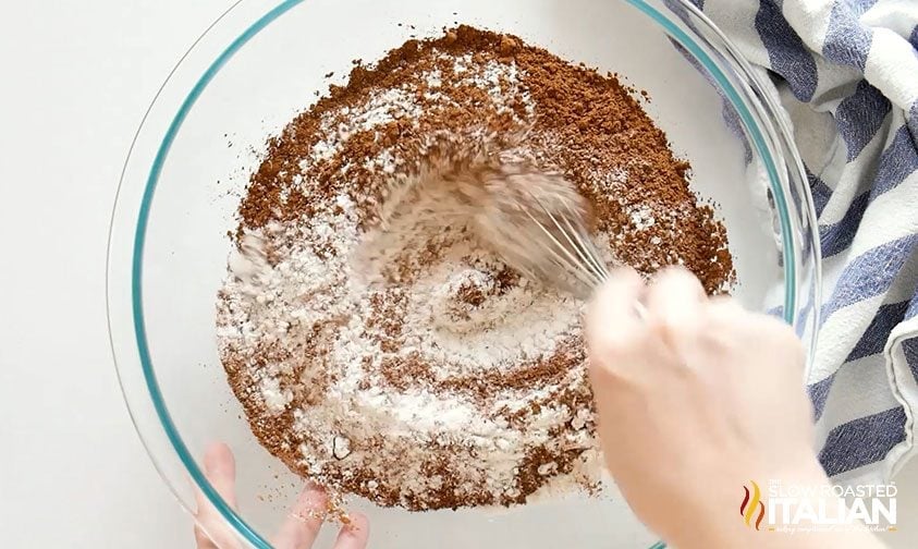 whisking cocoa powder and flour together in bowl
