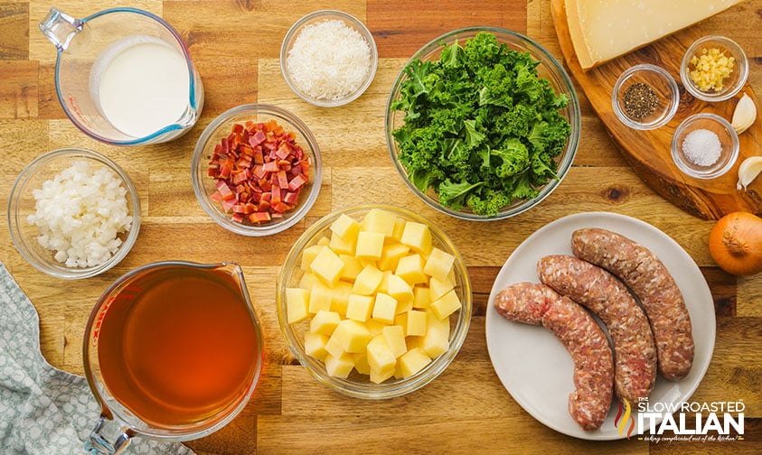 sausage potatoes spinach and other ingredients in small bowls on counter