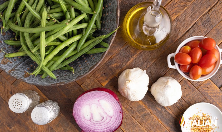 ingredients in small bowls to make Italian green beans recipe.