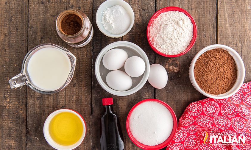 overhead: bowls of ingredients for chocolate cake recipe