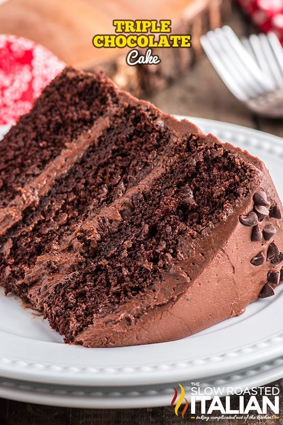 triple chocolate cake slice on a white plate