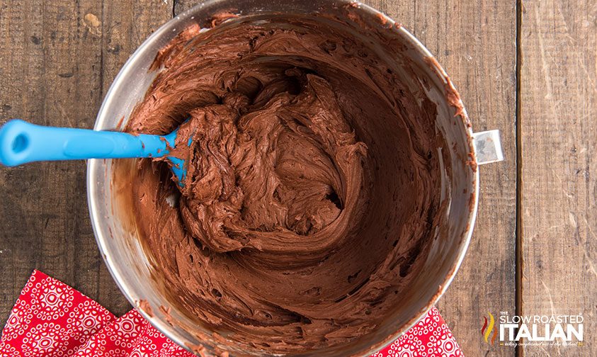 fluffy chocolate buttercream frosting in mixing bowl