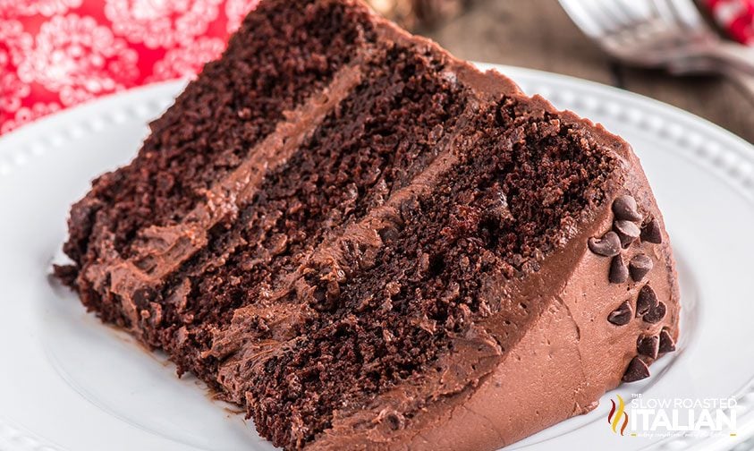 plated slice of rich chocolate layer cake