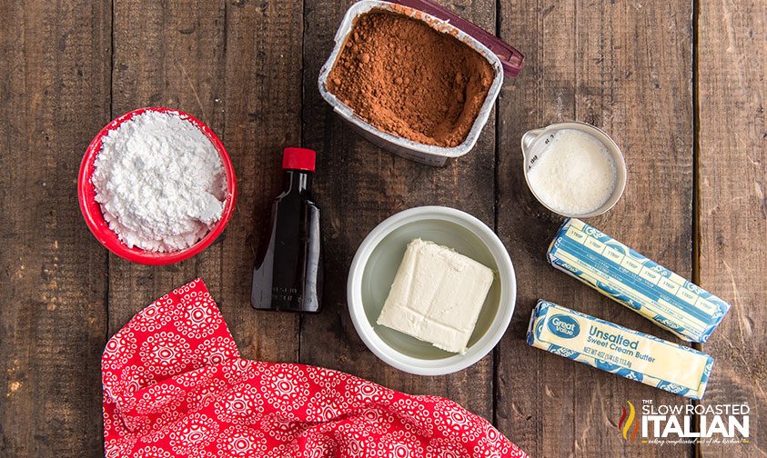 chocolate buttercream frosting ingredients on wooden counter