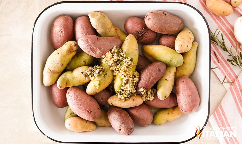 vegetable with garlic and rosemary in white baking dish