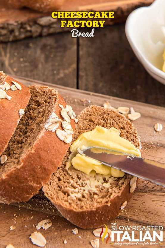 buttering slice of cheesecake factory bread