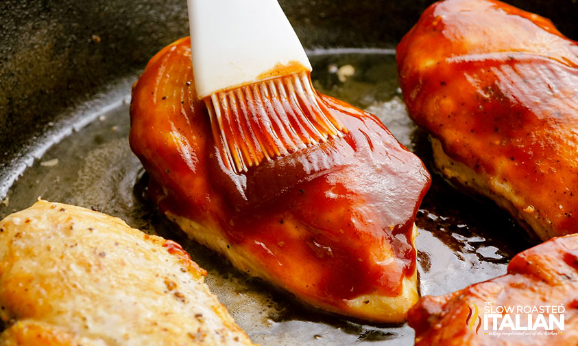 brushing Monterey Chicken with sauce