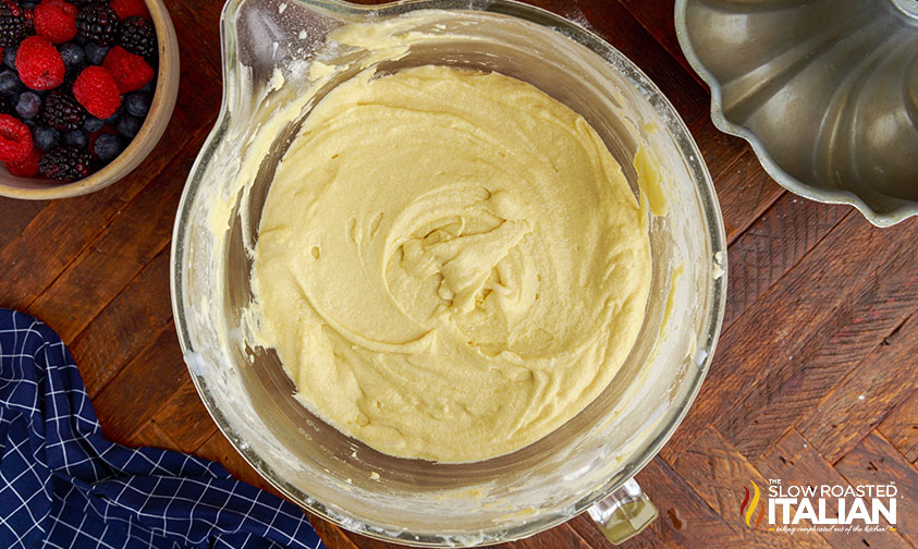 overhead; yellow batter in glass mixing bowl