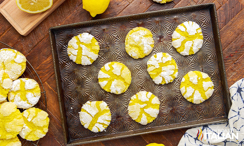 overhead: baked lemon crinkle cookies on baking sheet