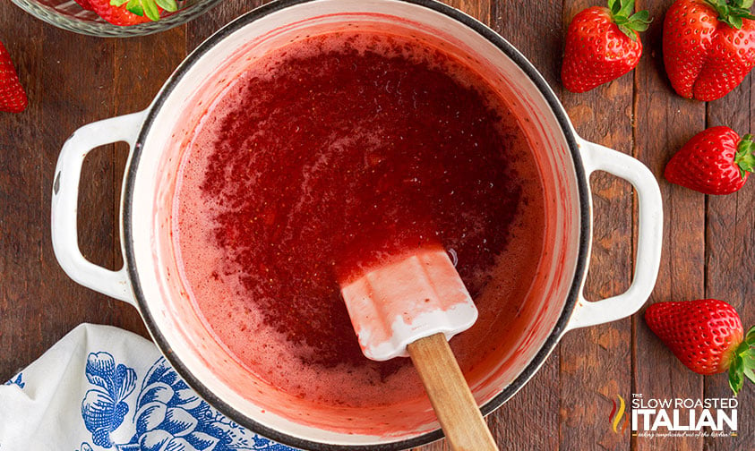 overhead: strawberry puree cooking in pot