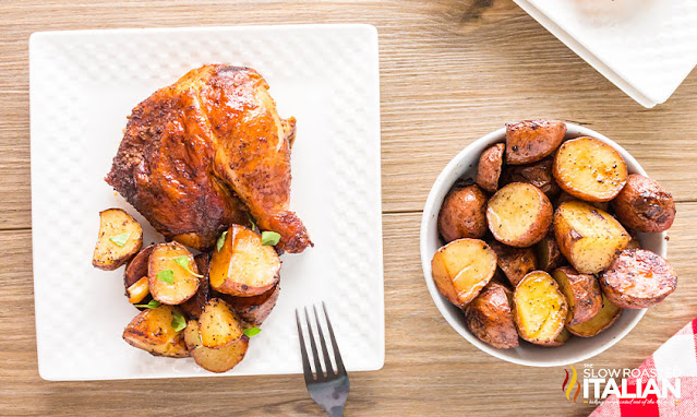 chicken and potatoes on white serving platter