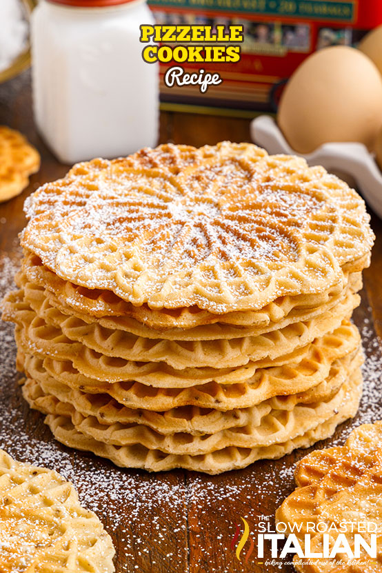pizzelle cookies dusted with powdered sugar and stacked