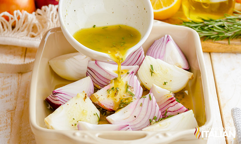 baked onions sauce poured over onions