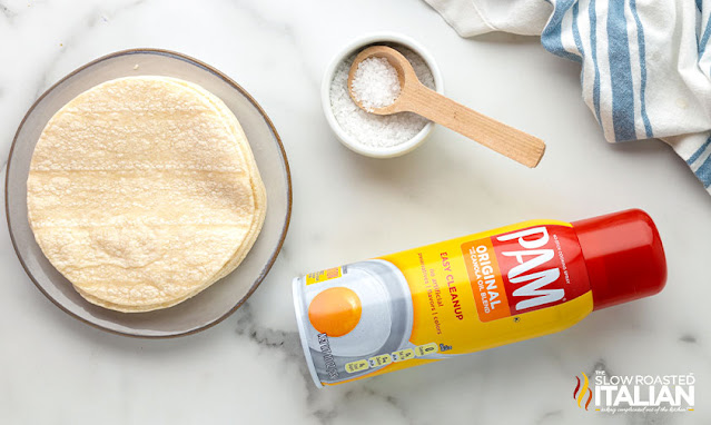 plate of flour tortillas next to dish of sea salt and can of non-stick cooking spray