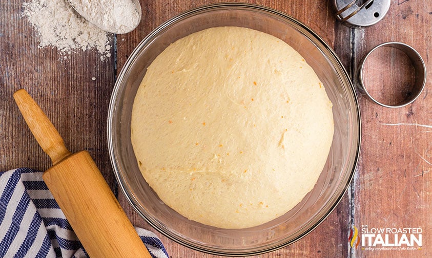 italian donuts dough rising in bowl