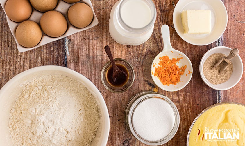 bomboloni recipe ingredients on wooden table