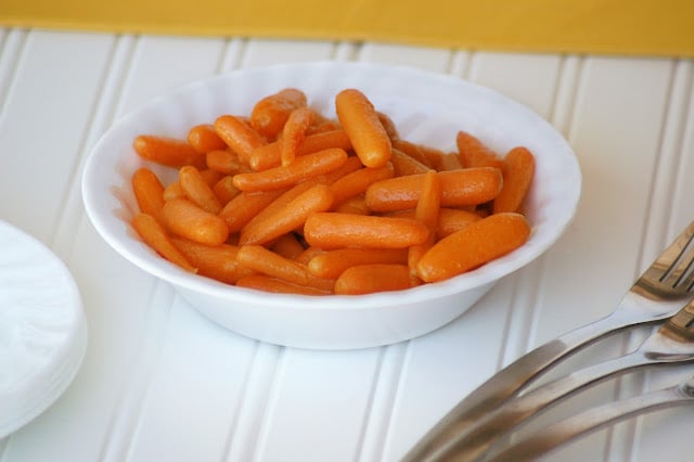 candied carrots in white bowl