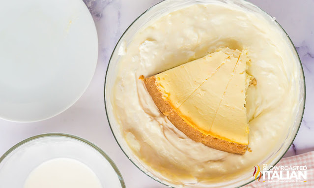 slice of cheesecake in no churn ice cream recipe mixture