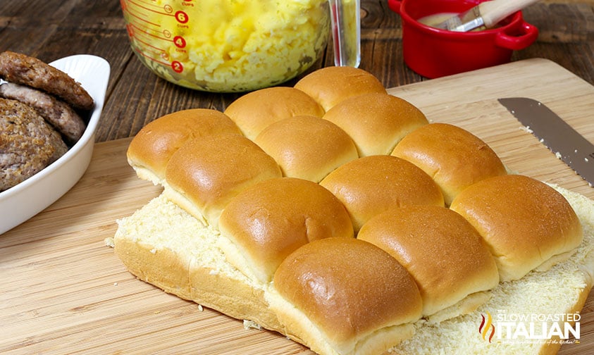 slider buns sliced open on cutting board
