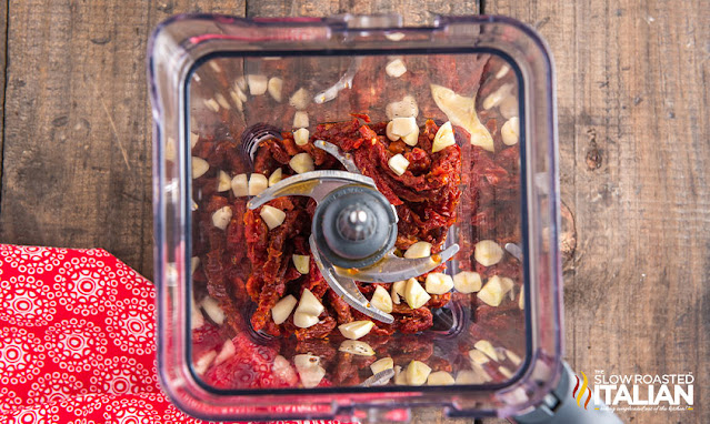 tomatoes and garlic in a food processor