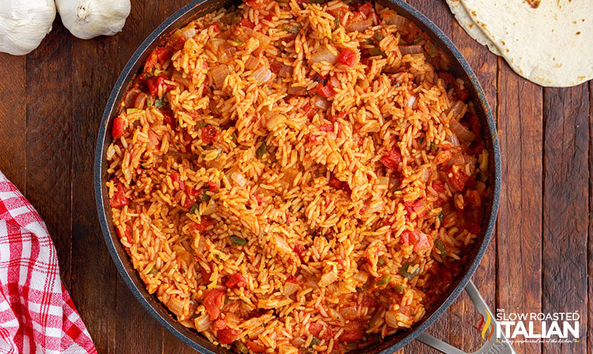 mexican red rice in a skillet for taco bell quesarito
