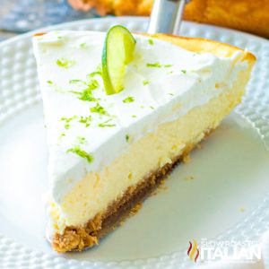slice of key lime baked cheesecake on white plate