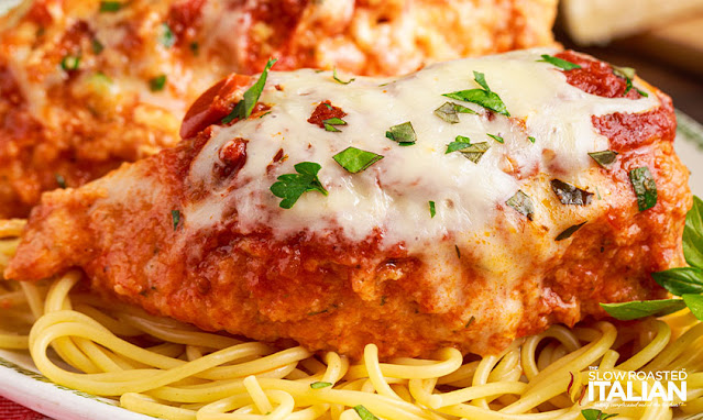 slow cooker chicken parmesan on bed of pasta