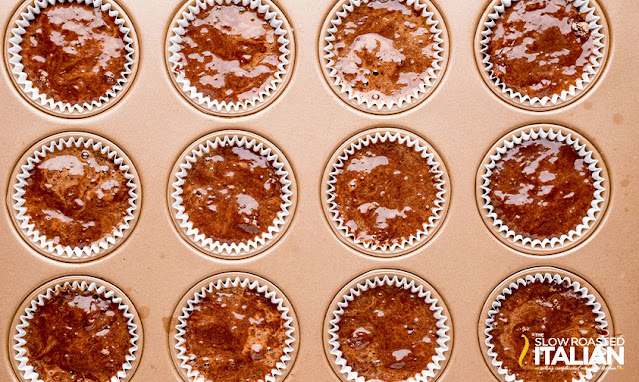 muffin tin with chocolate batter in liners