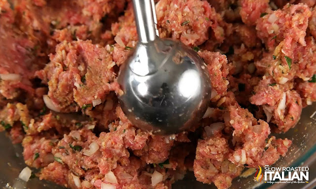 scooping meat mixture for sweet and sour meatballs
