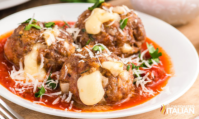 plate of cheese stuffed meatballs in marinara sauce