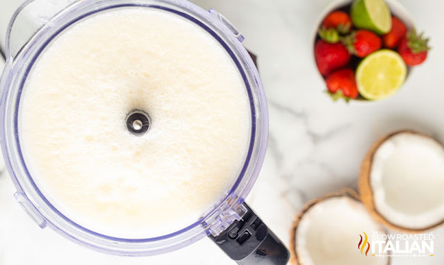 pina colada with coconut rum in food processor for lava flow drink