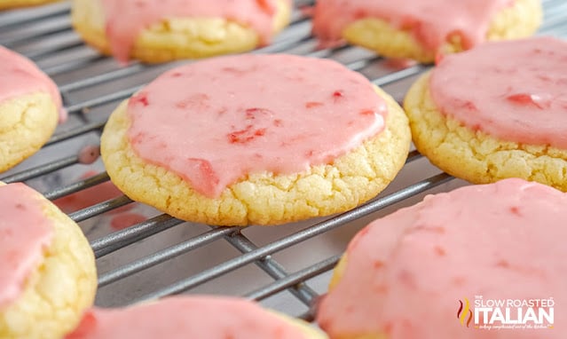 pink glazed cookies on a wire rack