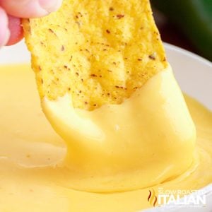 dipping corn chip into taco bell nacho cheese