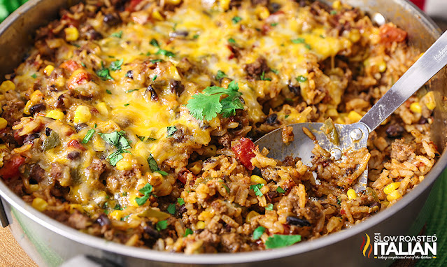 serving spoon in taco rice casserole