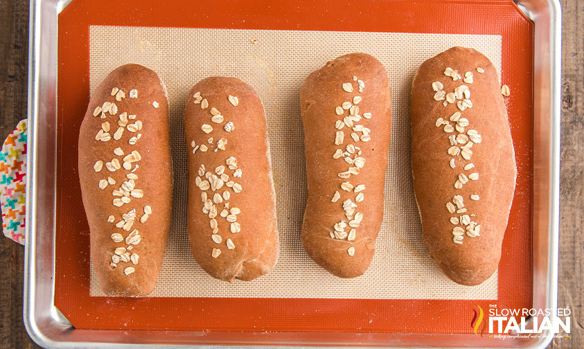 4 loaves of baked baguettes on baking pan