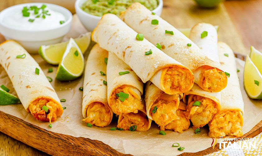 platter of baked shredded chicken taquitos