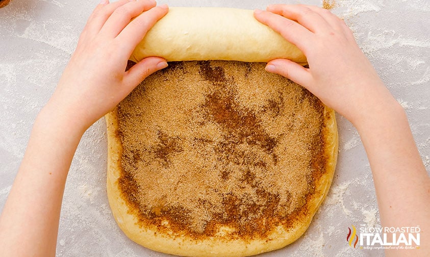 rolling sweet dough layered with cinnamon sugar