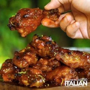 hand holding honey sriracha wings