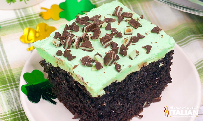 slice of St. Patrick''s Day cake topped with mint frosting