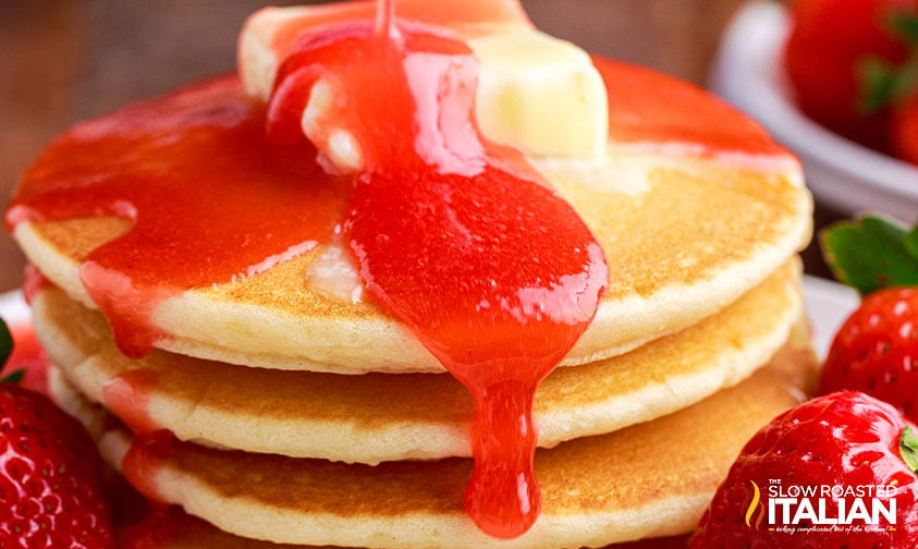 strawberry pancake syrup on stack of pancakes