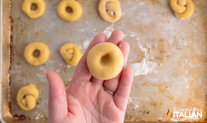 dough for easter cookies in woman's hand