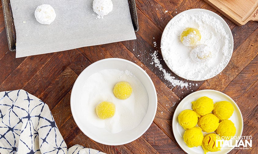 rolling yellow dough in powdered sugar