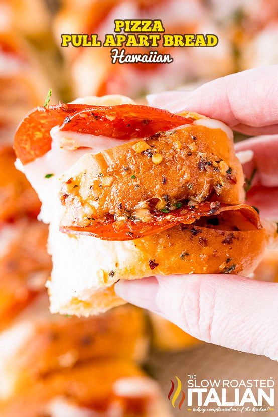 titled (shown in woman's hand close up) pizza pull apart bread