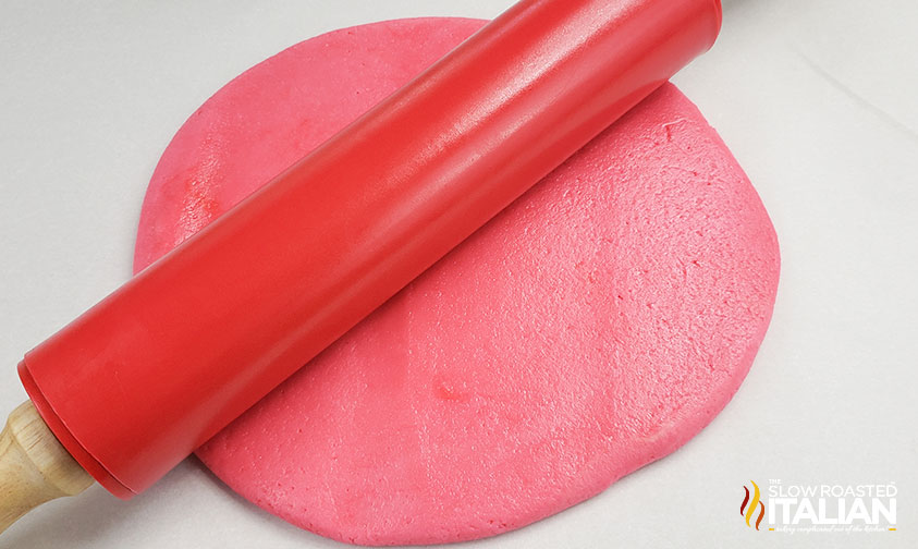 rolling pin on pink swirl cookies dough